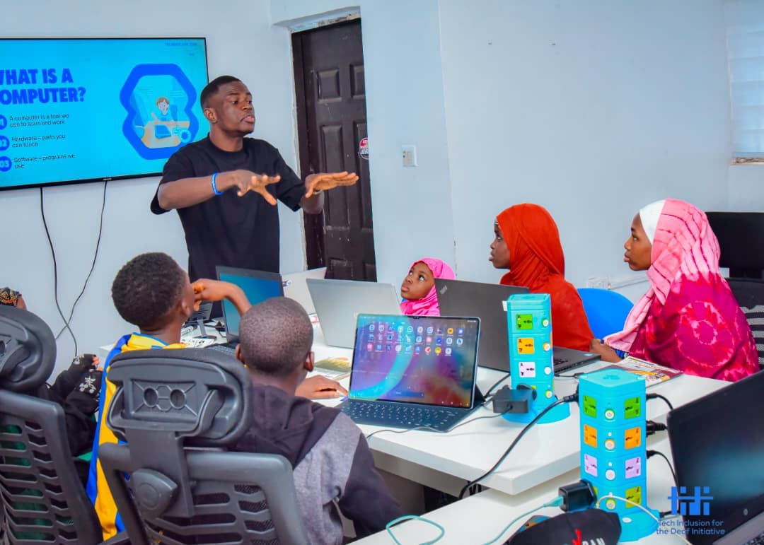 Deaf students working on laptops during a TIDI technology skills programme